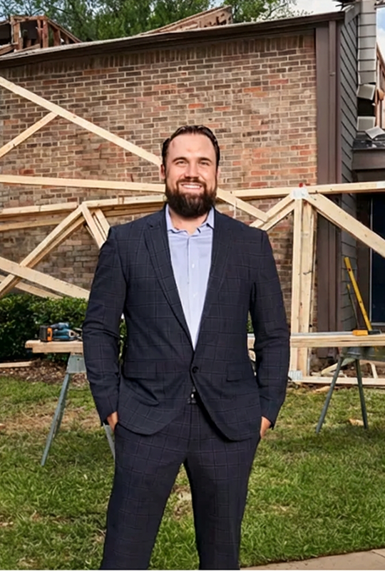 Dustin Doan standing in front of a project site