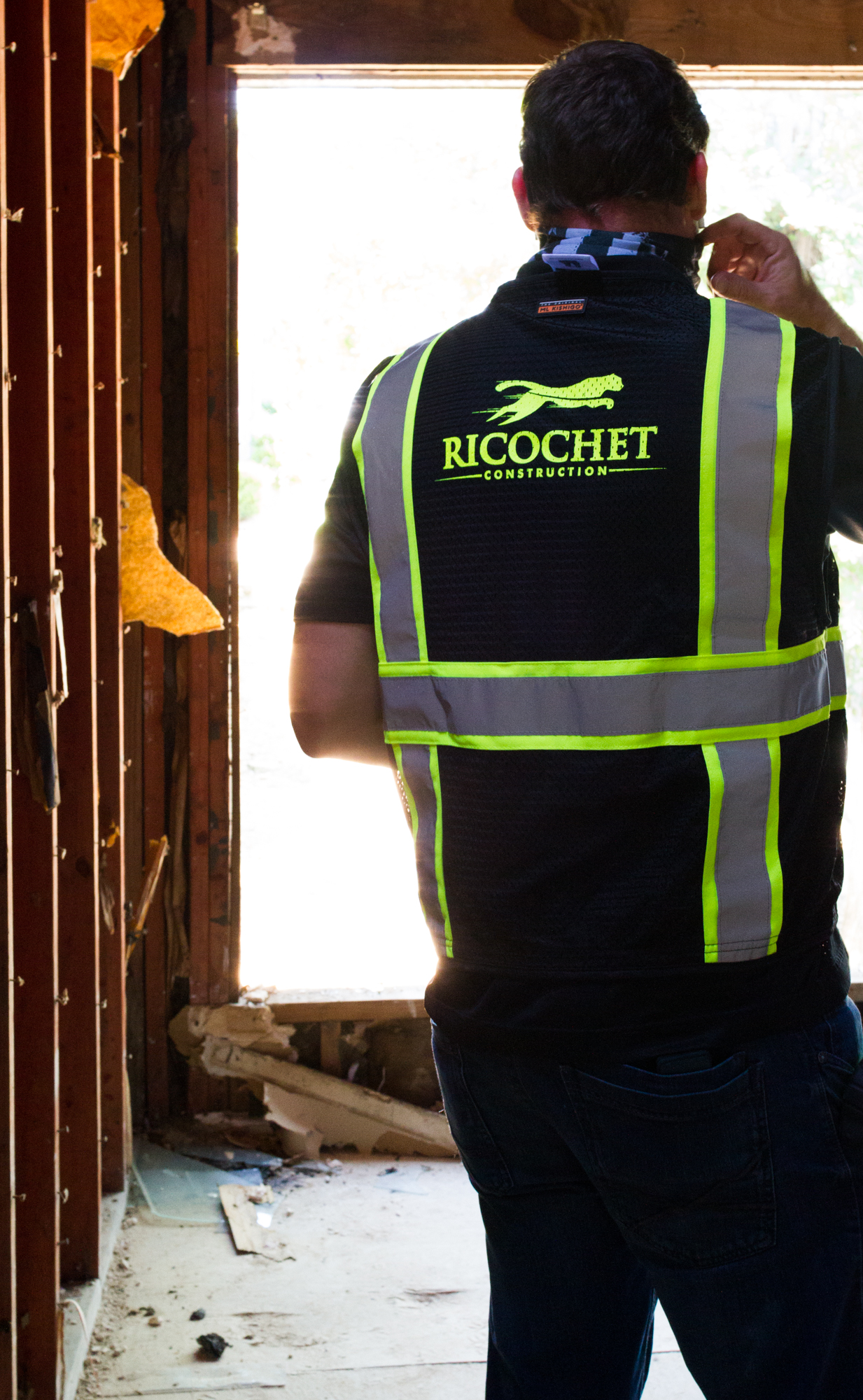 Ricochet Construction team standing in
front of a property under renovation